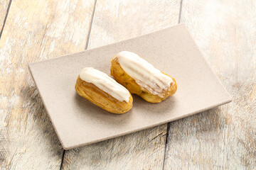 Delicous eclair with ising and cream