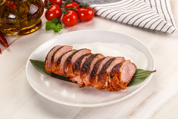 Sliced duck breast baked with cherry