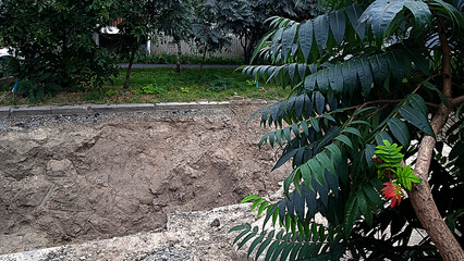 Photo of repair work, dug up road.