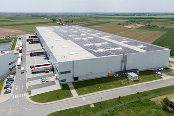 Logistics centers with solar panels on roofs. Aerial view