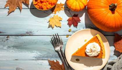 Slice of pumpkin pie with whipped cream on a plate, surrounded by autumn leaves and pumpkins