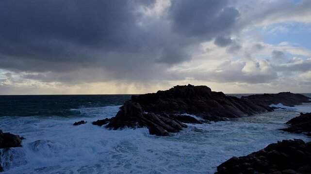 waves of the rough sea in the indian ocean splashing around Canal Rocks at the rocky coastline of Yellingup, Margaret River Region in Western Australia with dramatic sky.