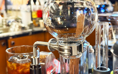 Close-up stainless steel clamp with round bottom flask.