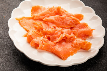 Smoked salmon fish seafood portion size natural product tasty snack fresh delicious gourmet food background on the table rustic top view copy space pescetarian diet