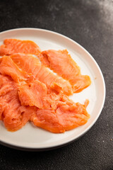 Smoked salmon fish seafood portion size natural product tasty snack fresh delicious gourmet food background on the table rustic top view copy space pescetarian diet