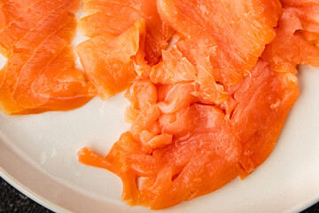 Smoked salmon fish seafood portion size natural product tasty snack fresh delicious gourmet food background on the table rustic top view copy space pescetarian diet