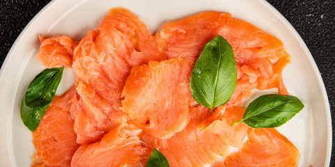 Smoked salmon fish seafood portion size natural product tasty snack fresh delicious gourmet food background on the table rustic top view copy space pescetarian diet