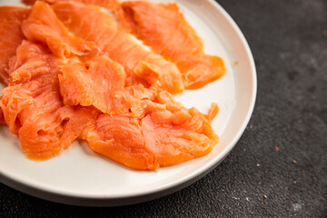Smoked salmon fish seafood portion size natural product tasty snack fresh delicious gourmet food background on the table rustic top view copy space pescetarian diet