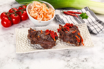 Baked beef cheeks with vegetables
