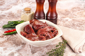 Raw uncokked chicken liver in the bowl