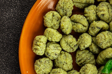 Gnocchi spinach potato dough second course portion size natural product tasty snack fresh delicious gourmet food background on the table rustic top view copy space