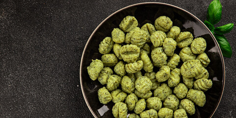 Gnocchi spinach potato dough second course portion size natural product tasty snack fresh delicious gourmet food background on the table rustic top view copy space