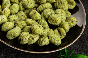 Gnocchi spinach potato dough second course portion size natural product tasty snack fresh delicious gourmet food background on the table rustic top view copy space
