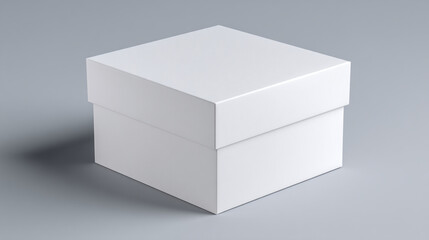 A simple studio shot showing a closed square white box with a lid on a gray background