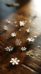Delicate snowflake motifs with scattered leaves across polished wooden table, clear focus, no text or logo