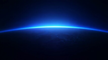 Obraz premium View of Earth's horizon from space with a glowing blue atmospheric glow against the darkness of space