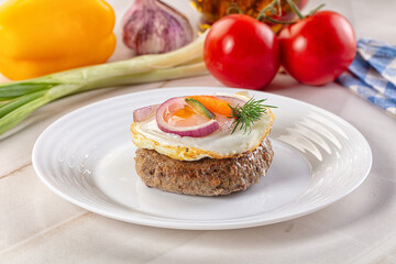 Beefsteak chop with roasted egg