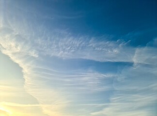 Evening sky with wispy cirrus clouds creating atmospheric background