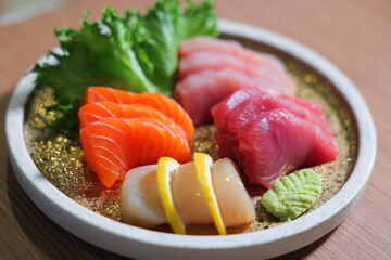 Japanese Sashimi: Salmon, Tuna, and Scallops. Ideal for: Sushi and sashimi lovers, Japanese food, and high-end restaurants.