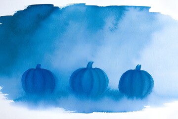 Blue painted pumpkins in a foggy atmosphere