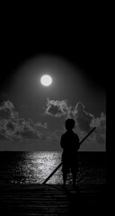 Fototapeta premium Lone figure rowing a boat under a bright full moon on a calm ocean at night