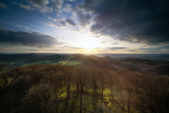 Evening view from Rimberg tower (near Dautphe, Germany) in early spring. First fresh green on the meadows but not yet on the beech trees.