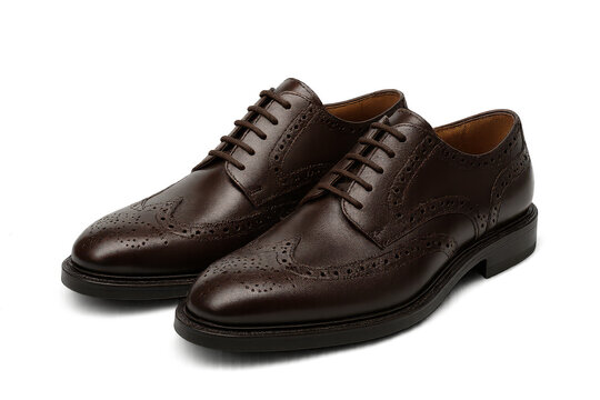 Elegant brown leather brogue shoes isolated on transparent background, pair
