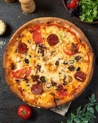 Delicious pizza topped with pepperoni, vegetables, and cheese served on a rustic wooden table with fresh ingredients nearby