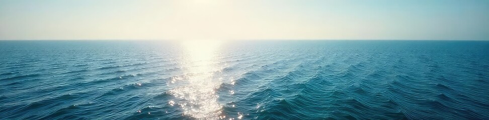 Obraz premium Vast, tranquil ocean stretching to the hazy horizon, sunlight shimmering on the water's surface A serene seascape perfect for travel, nature, or relaxation themes , sunlight, waves
