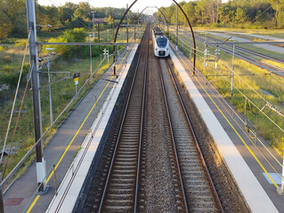 French regional express train pulling into a small station