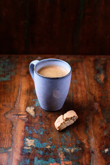 Cup of coffee on rustic wooden background. Soft focus. Copy space	