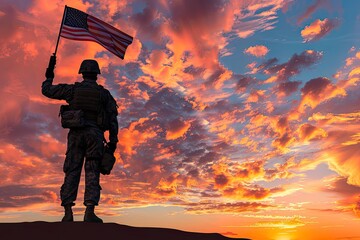 Silhouette of a soldier holding an American flag against a vibrant sunset sky.  The image evokes feelings of patriotism and remembrance