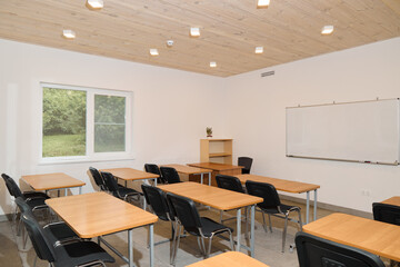 A modern classroom interior with desks and chairs designed for learning and collaboration