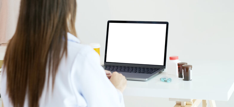 Laptop mock up, Laptop computer with blank screen and medicines on docter table
