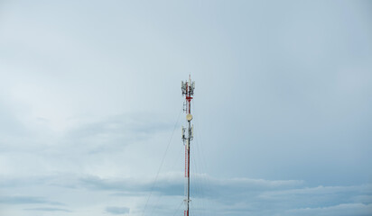 Signal tower or Mobile phone tower .Global connection and internet network concept.on blue sky,Telecommunication tower.