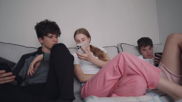 4k Shot of Teenagers Scrolling Social Media on Smartphones