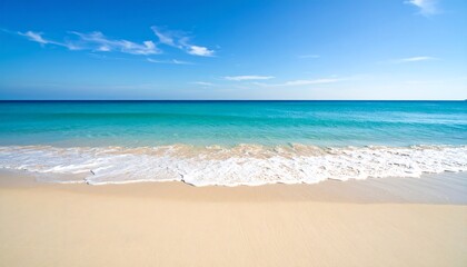 Fototapeta premium Vast beach, calm turquoise sea, sunny sky