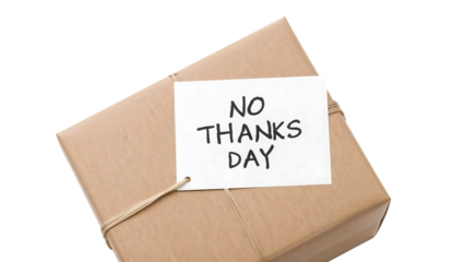 No thanks day concept with brown paper wrapped gift box and handwritten message card for anticonsumerism or minimalism theme