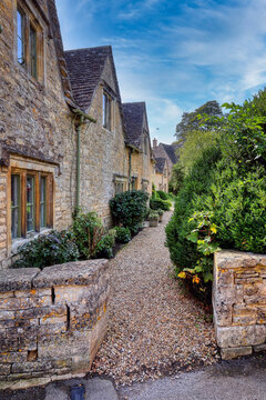 The historic and picturesque village of Bibury, in the Cotswolds, Gloucestershire, England, famous for its medieval stone houses