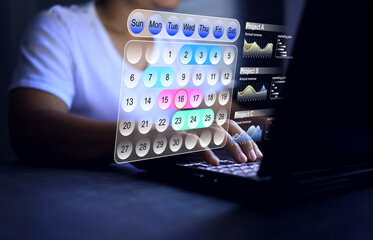 Project management concept with a man working on schedule calendar making an appointment on laptop computer