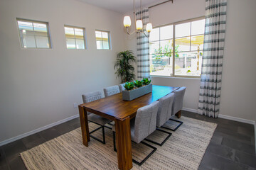 Dining Area With Wooden Table And Six Chairs