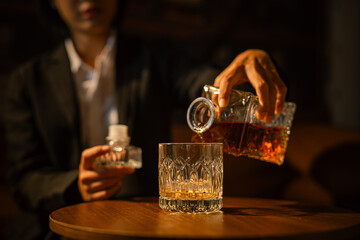 Closeup business woman holding a glass of whiskey