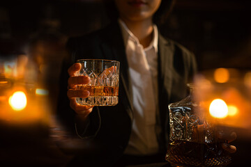 Closeup businessmen holding a glass of whiskey