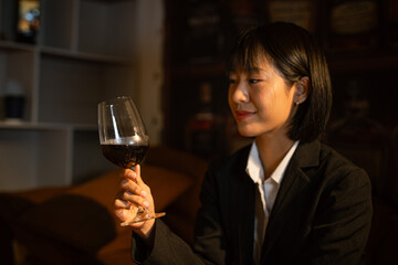 Closeup business woman holding a glass of wine