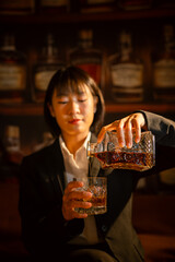 Closeup business woman holding a glass of whiskey