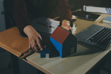 Customer signing a real estate contract in real estate agency.