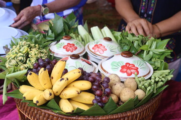 woman holding basket of fruits