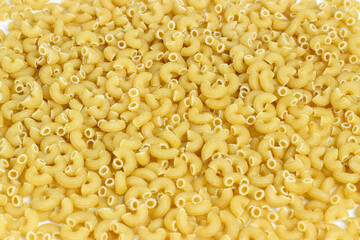 A raw, uncooked macaroni background. Perfect for design and advertising needs.