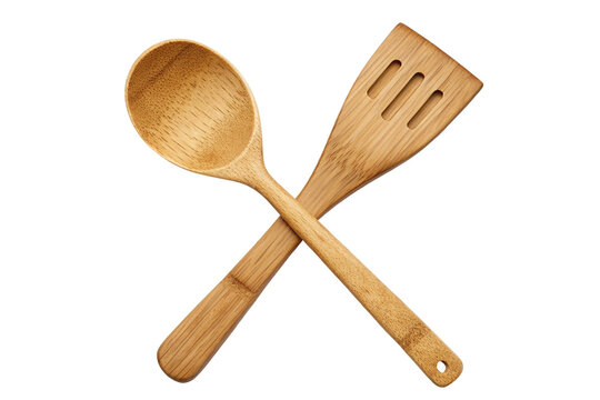 Eco-friendly bamboo kitchen utensils crossed on black background for cooking enthusiasts image