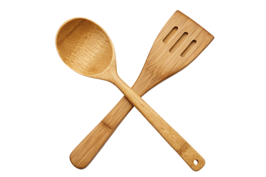 Eco-friendly bamboo kitchen utensils crossed on black background for cooking enthusiasts image